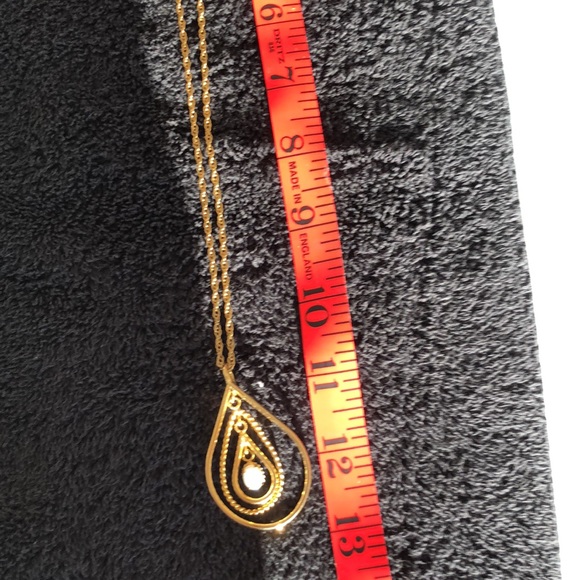 Vintage Opal like free moving oval stone, 3 free moving oval gold colored hoops. - Picture 6 of 9